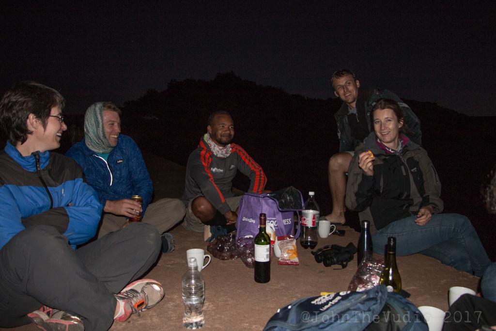 Group of people sitting around karoo drinks evening