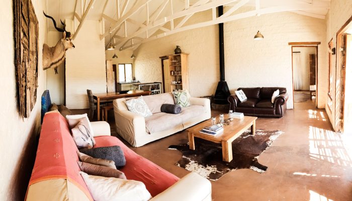 karoo eco river lodge living room couches fire place